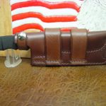 Custom Made Cross Draw Knife Sheath That Will fit The SOG Seal pup Light Brown. A lot of Leather for The Price and can be Worn on The Left or Right Hand Side. Sheath only.