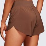 CRZ YOGA High Waisted Dolphin Athletic Running Shorts for Women High Split Comfy Mesh Liner Gym Workout Track Shorts Coffee Brown Small